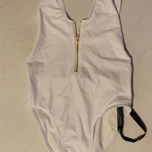 White one piece with zipper on front